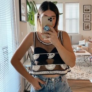 Sheer black crop top.